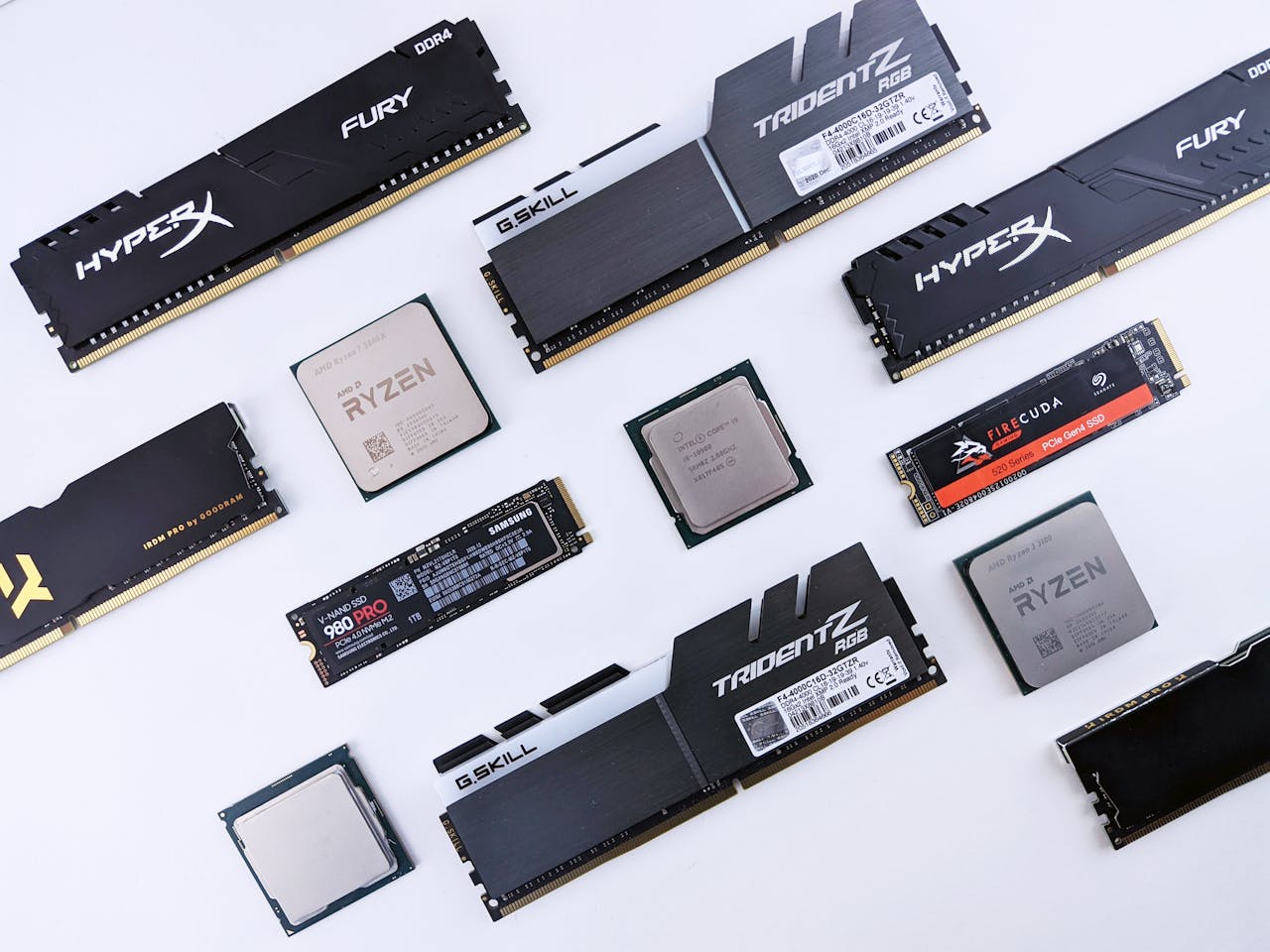 High-quality image of various computer components, including RAM and CPUs, on a white background.